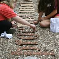 Viz undergrads lay “Pennies for Procrastination” at Sully statue